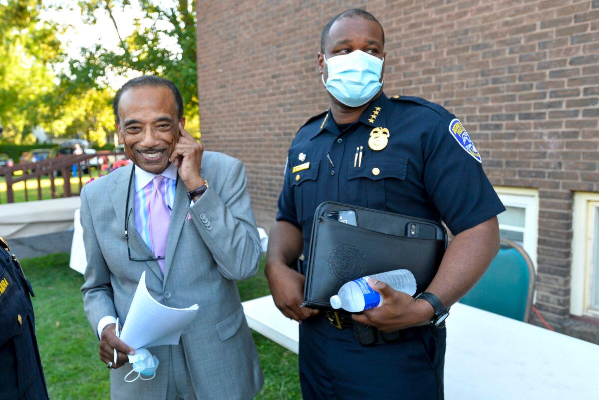 Rochester Police Chief La'Ron Singletary (R) stands with Reverend Lewis W. Stewart (L) of the United Christian Leadership Ministry before a community meeting in Rochester, N.Y., on Sept. 3, 2020. (Adrian Kraus/AP Photo)