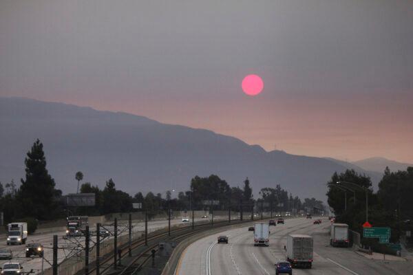 Smoke from wildfires burning east of Los Angeles dims the sunrise seen from Pasadena, Calif., on Sept. 7, 2020. (John Antczak/AP Photo)