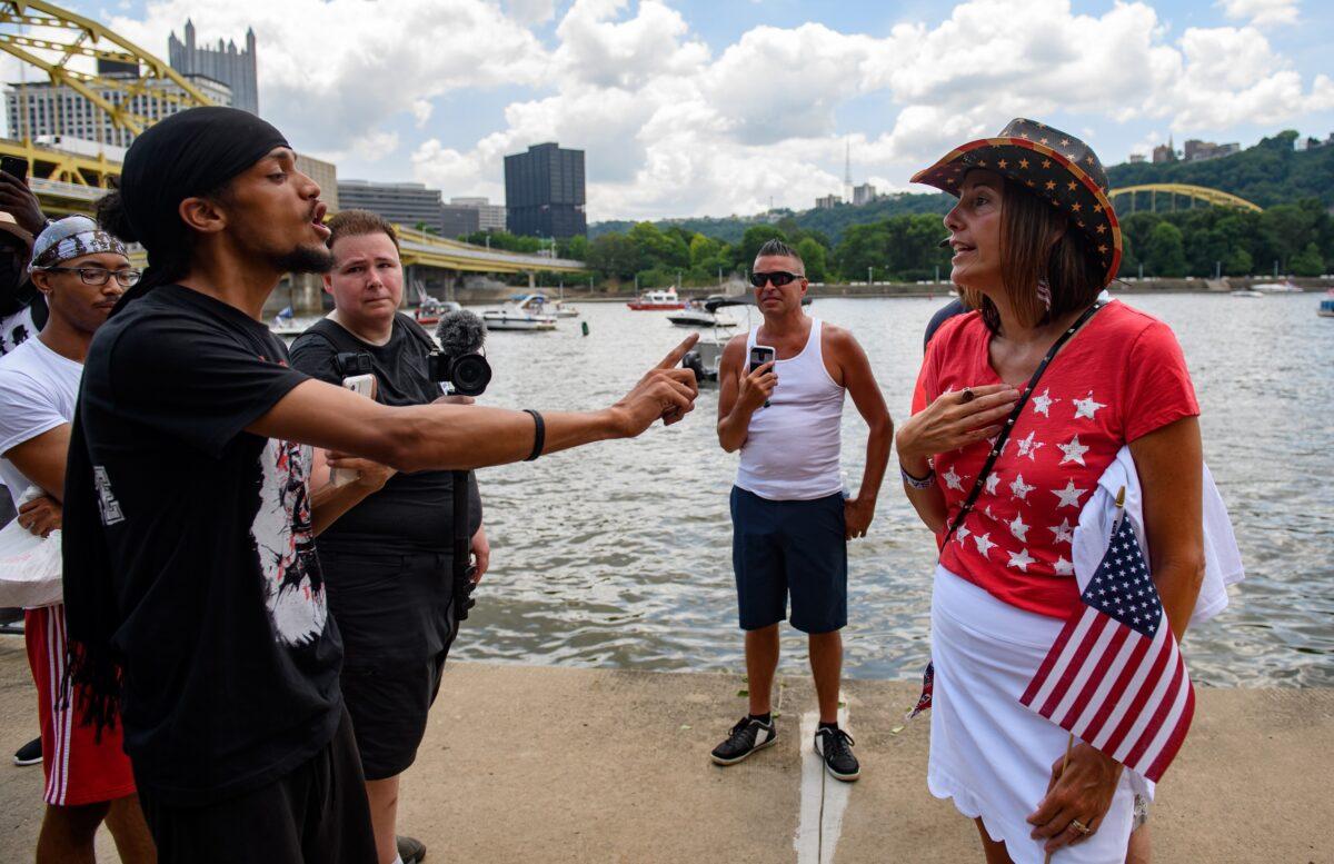 Lorenzo Rulli, 24 of Pittsburgh, a Black Lives Matter activist, trades words with a supporter of President Donald Trump in Pittsburgh, Penn., on July 4, 2020. (Jeff Swensen/Getty Images)