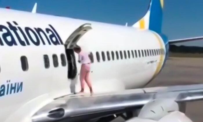 Video Shows Shocking Moment a Passenger Took a Walk on an Airplane Wing to Cool Off