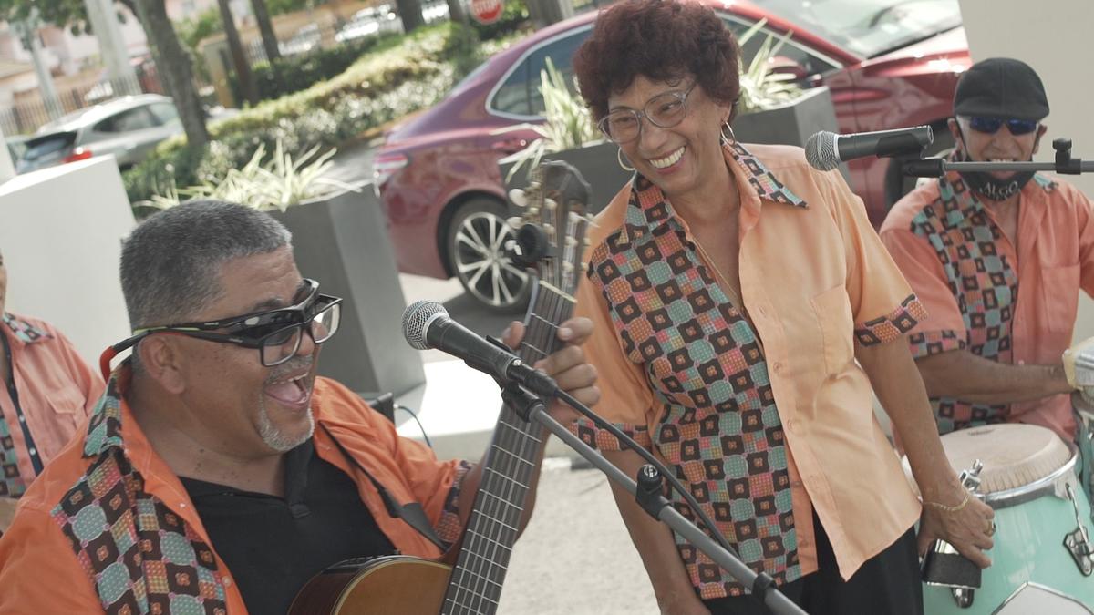 Marisel Lopez (C), president and singer of the band Algo Nuevo, with her crew during a performance at a retirement community in Hialeah, Fla. (Courtesy of Shamari Bryan/Kufre Eyo/Florida Film House)
