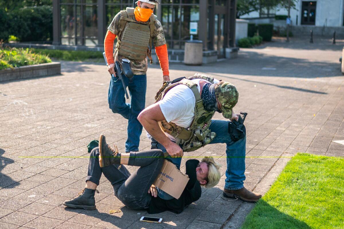  A man attacks a counter-protester during a pro-President Donald Trump rally in Salem, Ore., on Sept. 7, 2020. (Nathan Howard/Getty Images)