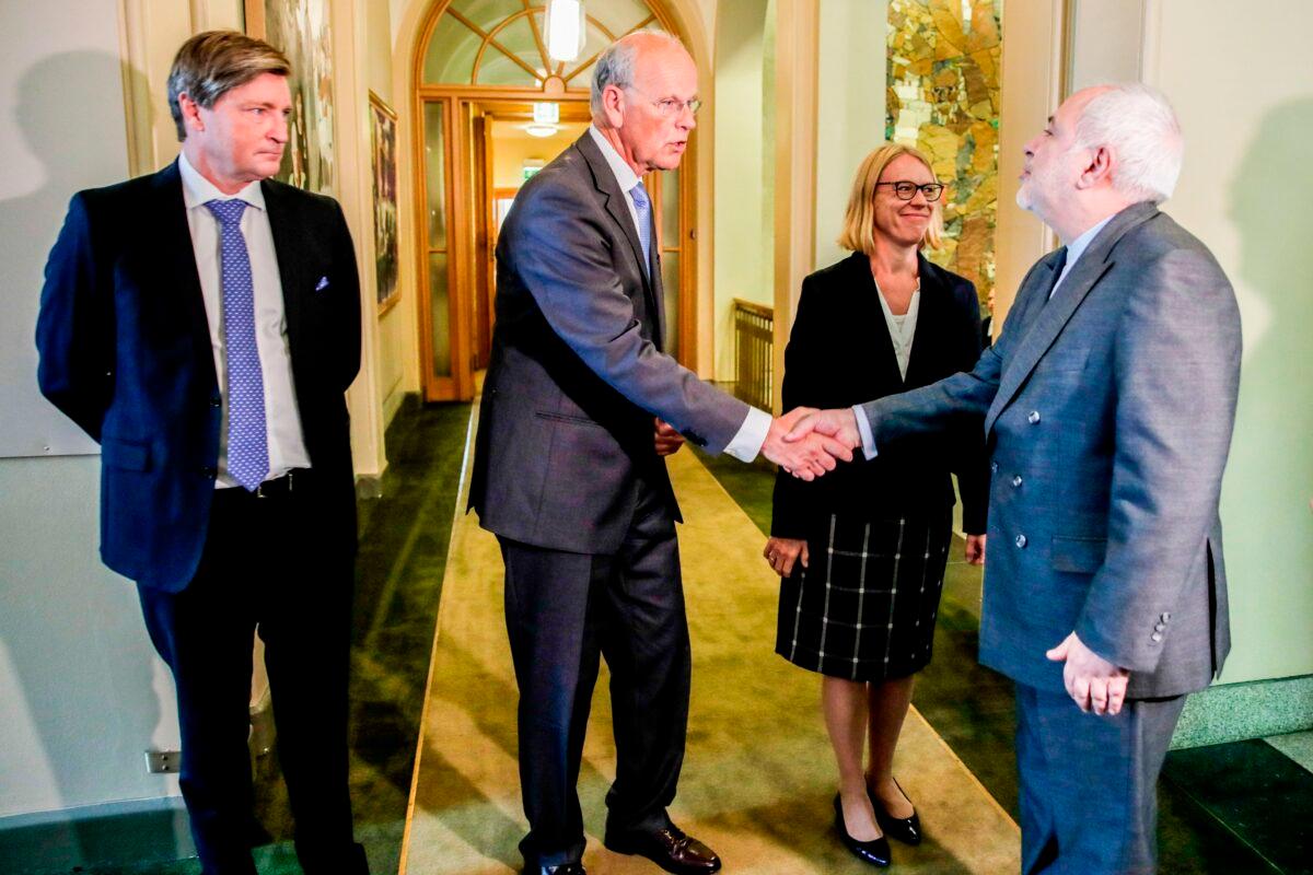 Christian Tybring-Gjedde (L) and other Norwegian Parliament members meet with Iran Foreign Minister Javad Zarif in Oslo on Aug. 22, 2019. (Vidar Ruud/AFP via Getty Images)