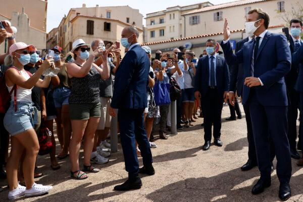  French President Emmanuel Macron, right, meets with residents during a visit in Bonifacio, Corsica island, on Sept.10, 2020. (Ian Langsdon/AP Photo)