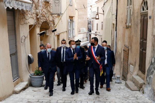  French president Emmanuel Macron, center, and Bonifacio Mayor Jean Charles Orsucci, right, visit Bonifacio, Corsica island, on Sept.10, 2020. (Ian Langsdon/AP Photo)