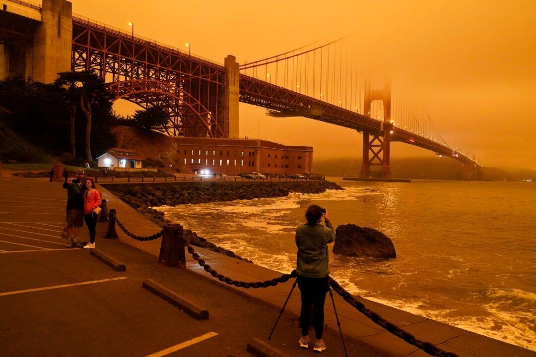 Massive Smoke Clouds From Wildfires Darken West Coast Sky