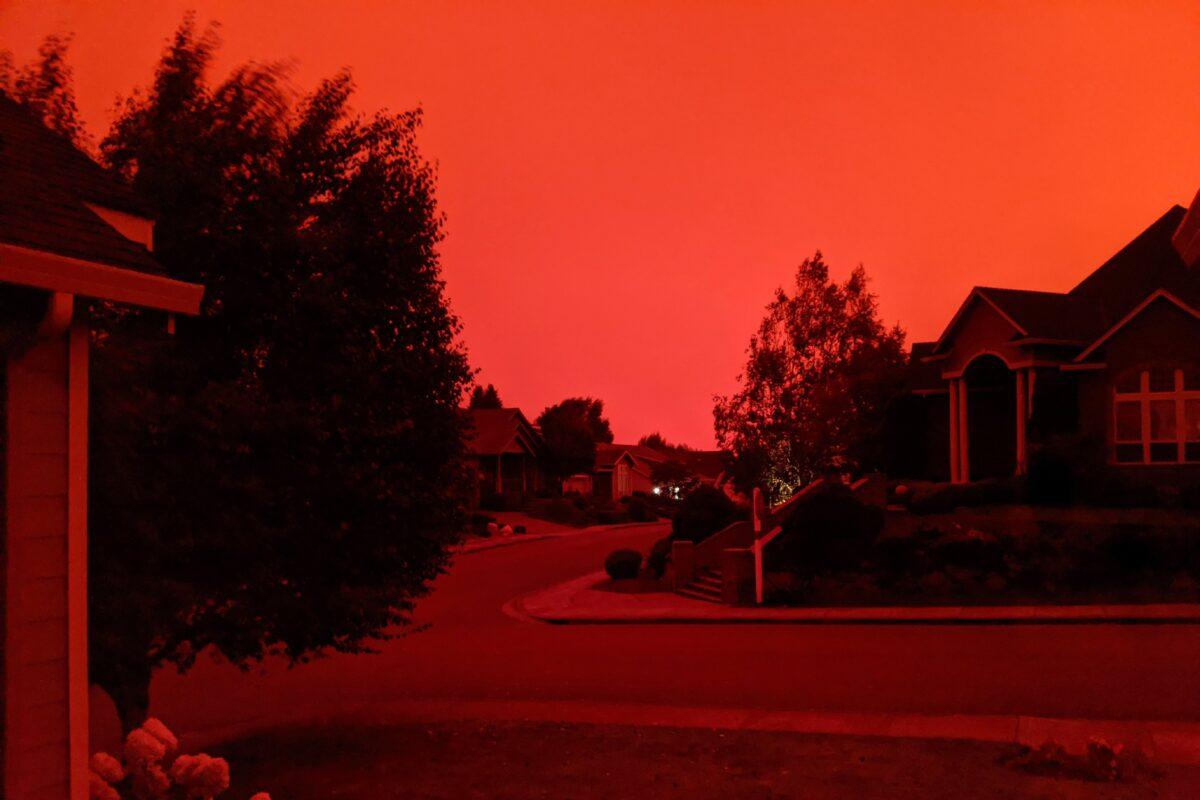 This photo taken from the home of Russ Casler shows the smoke-darkened sky well before sunset, around 5 p.m., in Salem, Ore., on Sept. 8, 2020. (Russ Casler via AP)