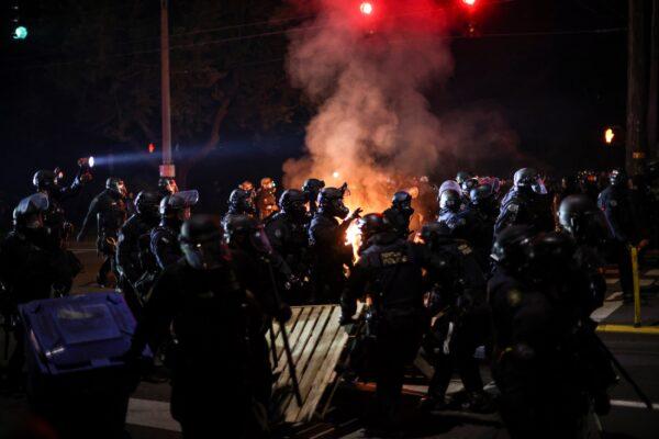 Police disperse rioters in Portland, Ore., Sept. 5, 2020. (Carlos Barria/Reuters)