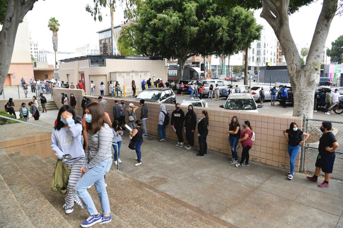 Students wait in line to pick up school resources at Hollywood High School in Hollywood, Calif., on Aug. 13, 2020. (Rodin Eckenroth/Getty Images)