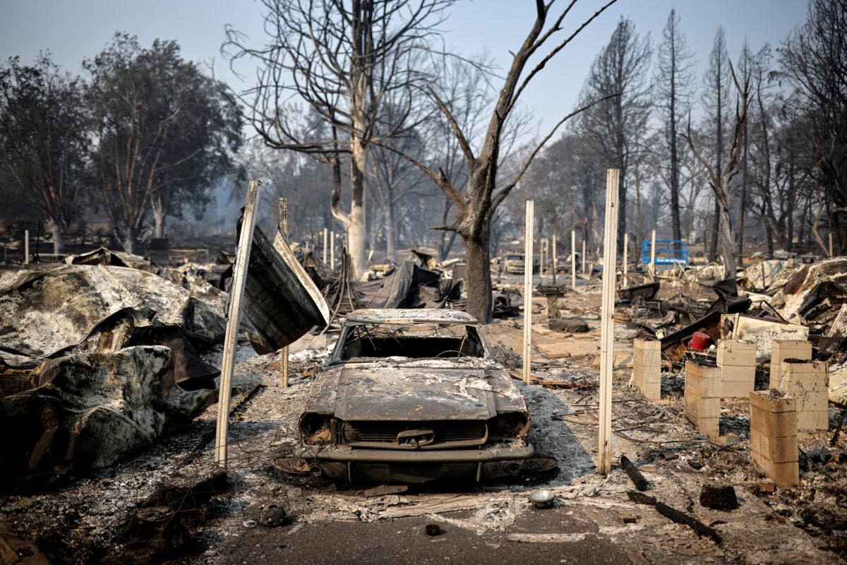  Burned car is seen in a neighborhood after wildfires destroyed an area of Phoenix, Ore., on Sept. 10, 2020. (Carlos Barria/Reuters)