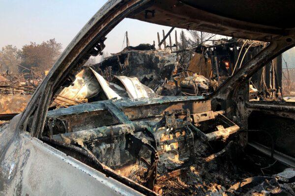 The interior of a vehicle is melted among the ruins of the Coleman Creek Estates mobile home park in Phoenix, Ore., on Sept. 10, 2020. (Gillian Flaccus/AP Photo)
