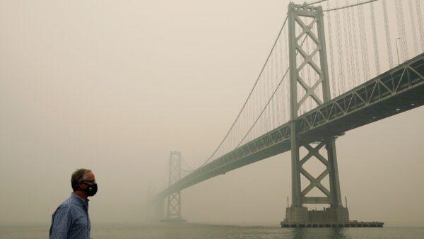 Smoke and haze from wildfires partially obscure the view of the San Francisco-Oakland Bay Bridge along the Embarcadero in San Francisco, Calif., on Sept. 10, 2020. (Jeff Chiu/AP Photo)