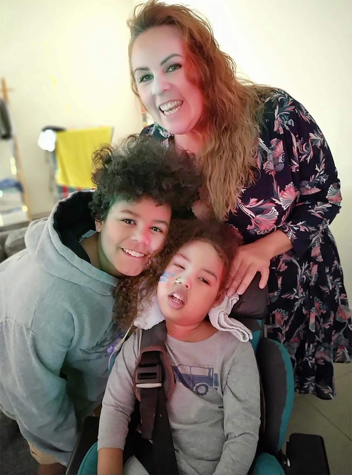 Rebecca Marsh, 41, with her two sons, Khaleed (L), 11, and Jahleel, 4. (Caters News)