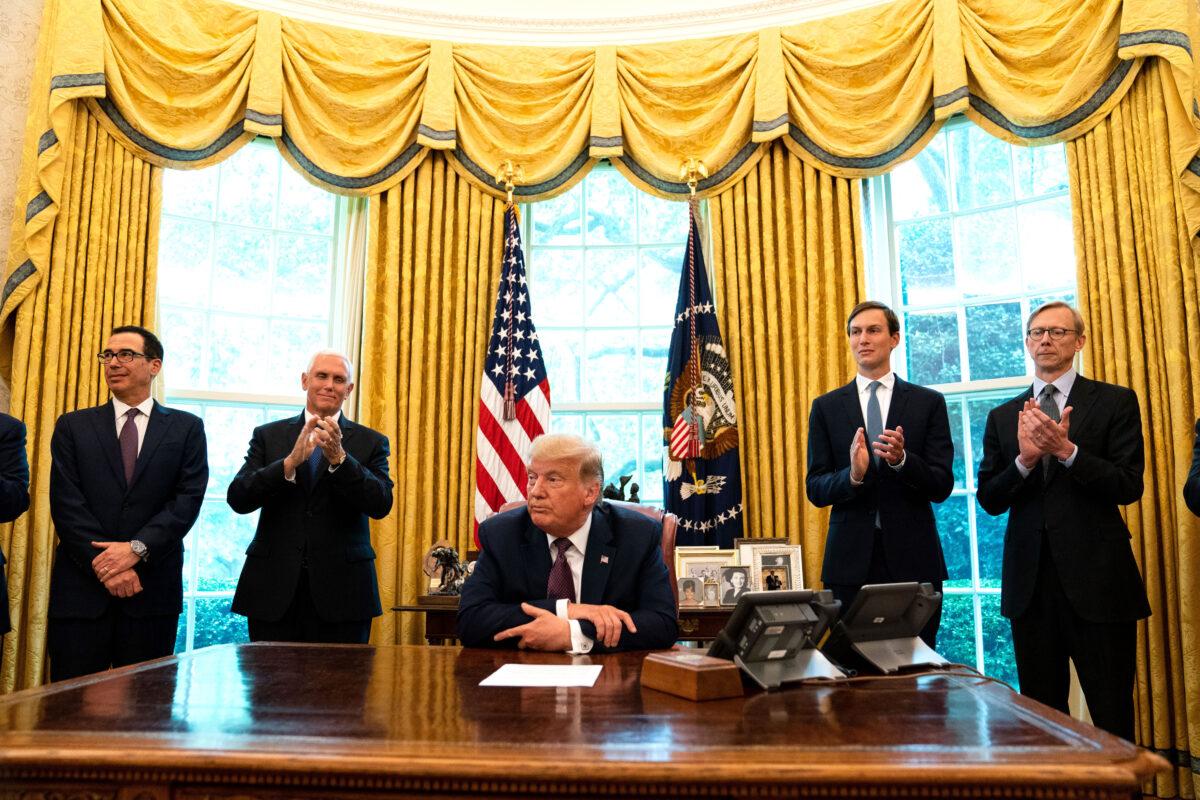  (L-R): Treasure Secretary Steven Mnuchin, Vice President Mike Pence, President Donald Trump, and adviser Jared Kushner, speak in the Oval Office to announce that Bahrain will establish diplomatic relations with Israel, at the White House on Sept. 11, 2020. (Anna Moneymaker-Pool/Getty Images)