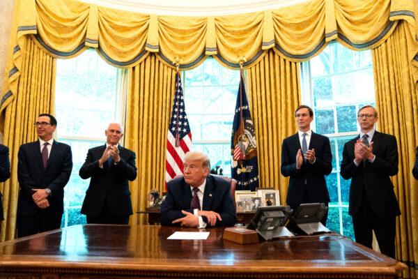 (L-R): Treasure Secretary Steven Mnuchin, Vice President Mike Pence, President Donald Trump, and Advisor Jared Kushner, speak in the Oval Office to announce that Bahrain will establish diplomatic relations with Israel, at the White House in Washington, on Sept. 11, 2020. (Anna Moneymaker-Pool/Getty Images)