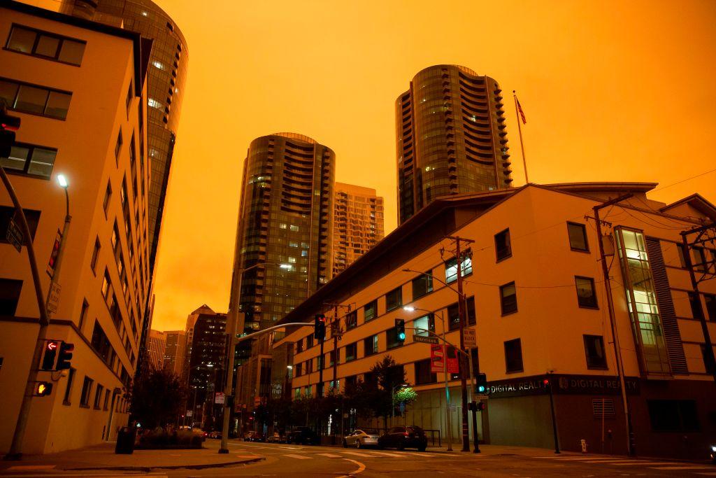 The Infinity Towers in Downtown San Francisco are seen under an orange smoke-filled sky. (BRITTANY HOSEA-SMALL/AFP via Getty Images)