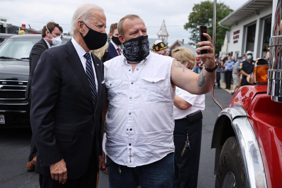 Democratic presidential nominee Joe Biden visits with members of the Shanksville Volunteer Fire Company's Station 627 after he visited the Flight 93 National Memorial in Shanksville, Pa., on Sept. 11, 2020. (Chip Somodevilla/Getty Images)