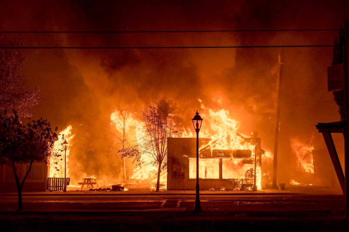 Buildings are engulfed in flames as a wildfire ravages the central Oregon town of Talent near Medford, Ore., on Sept. 8, 2020. (Kevin Jantzer via AP)