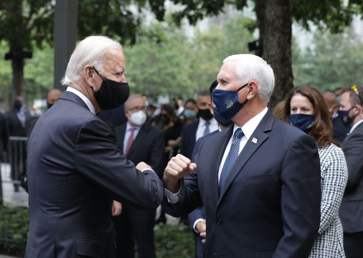 Democratic Presidential Candidate Joe Biden (L) greets US Vice President Mike Pence as they attend a ceremony at the 9/11 Memorial in New York to commemorate the 19th anniversary of the 9/11 attacks, on September 11, 2020. (Angela Weiss / AFP)