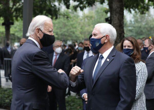 Democratic presidential candidate Joe Biden (L) greets Vice President Mike Pence as they attend a ceremony at the 9/11 Memorial in New York to commemorate the 19th anniversary of the 9/11 attacks, on Sept. 11, 2020. (Angela Weiss/AFP)