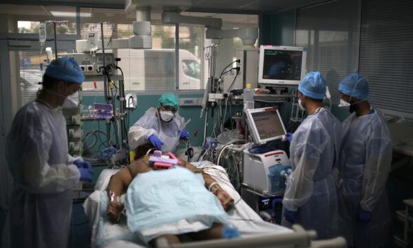 A medical crew works around a patient affected with COVID-19 in a Marseille hospital, in France, on Sept.10, 2020. (Daniel Cole/AP)