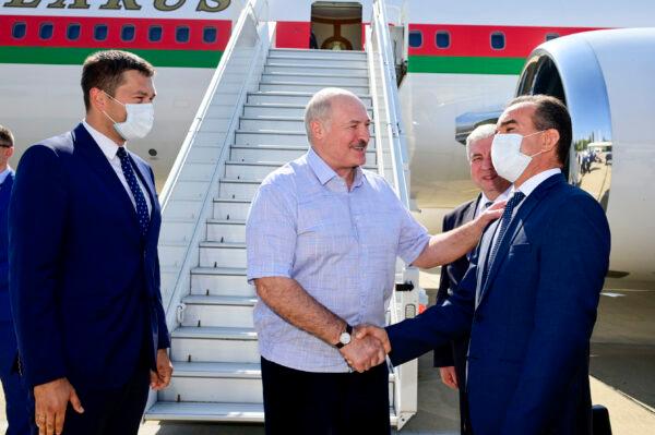 Belarusian President Alexander Lukashenko greets officials upon his arriving at the Black Sea resort of Sochi, Russia, on Sept. 14, 2020. (Andrei Stasevich /AP Photo)