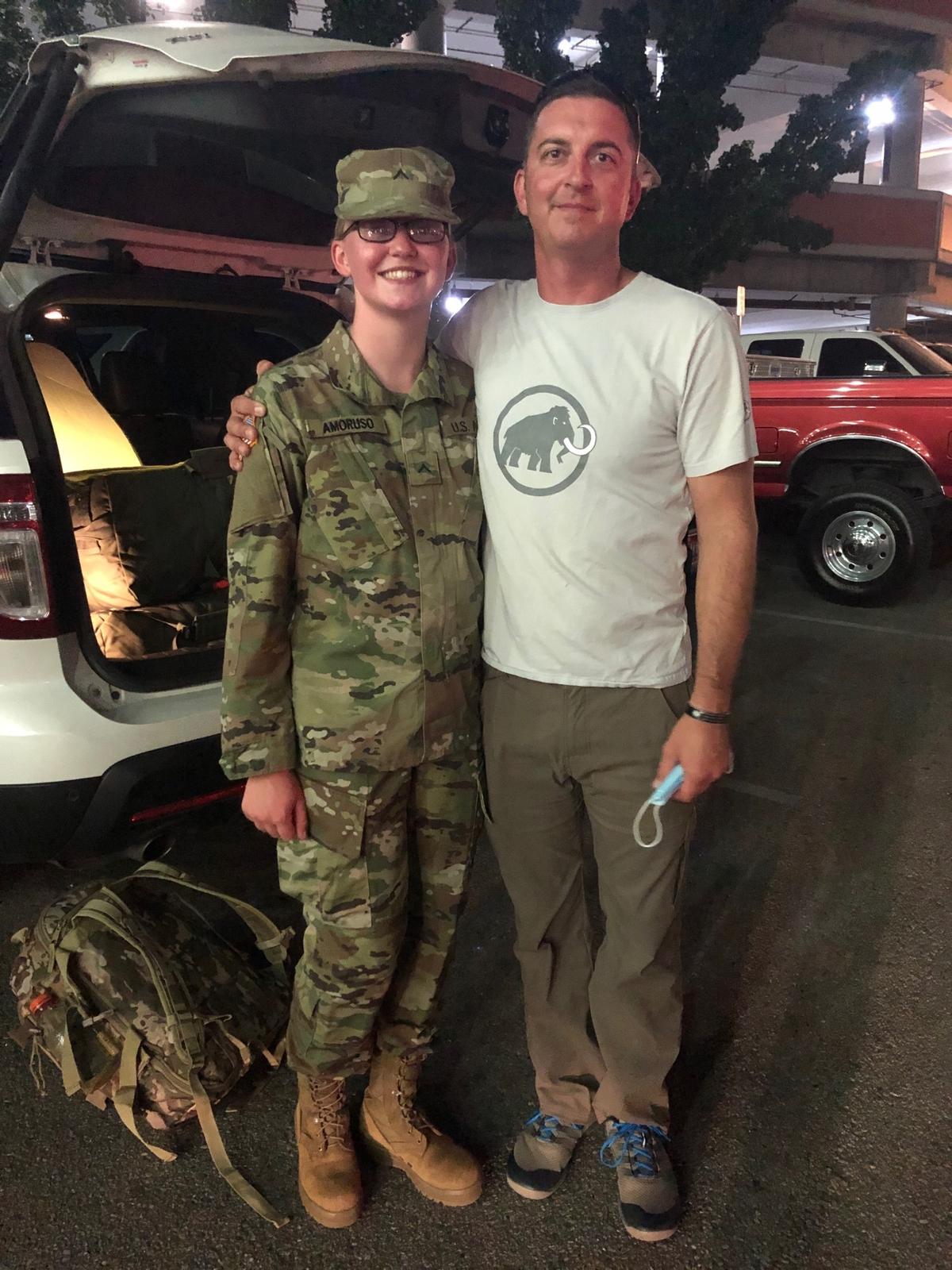 Idaho Army National Guard Pvt. Ashlynn Amoruso poses with her father, 1st Sgt. Dan Amoruso, at the Boise Airport upon returning from Basic Combat Training on Aug. 20, 2020 (<a href="https://www.dvidshub.net/image/6334606/impact-summer-high-school-student-spends-summer-basic-training-preparing-future">Idaho Army National Guard</a>/DVIDSHUB)