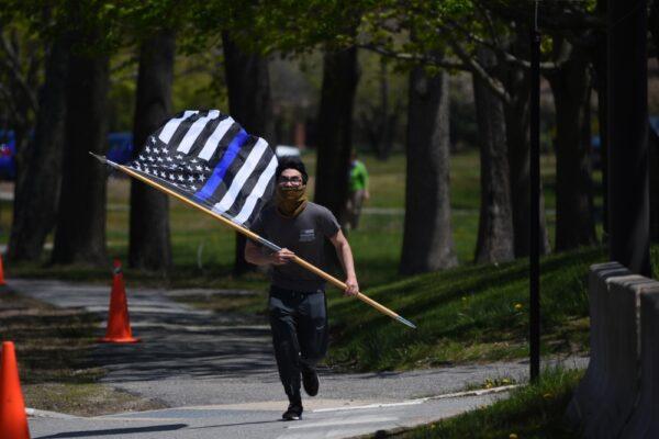 Airman 1st Class Jason Phan, 66th Security Forces Squadron entry controller, participates in a memorial run at Hanscom Air Force Base, Mass., on May 15, 2020. (Courtesy of U.S. Air Force/Mark Herlihy)