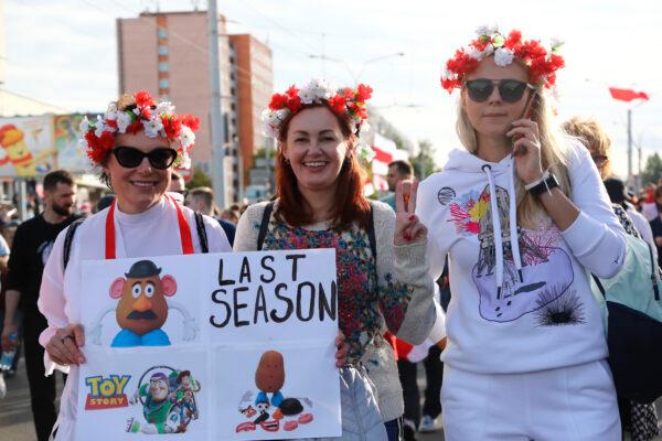 Women with a wreath on their heads pose for a photo during an opposition rally in Minsk, on Sept. 13, 2020. (TUT.by via AP)