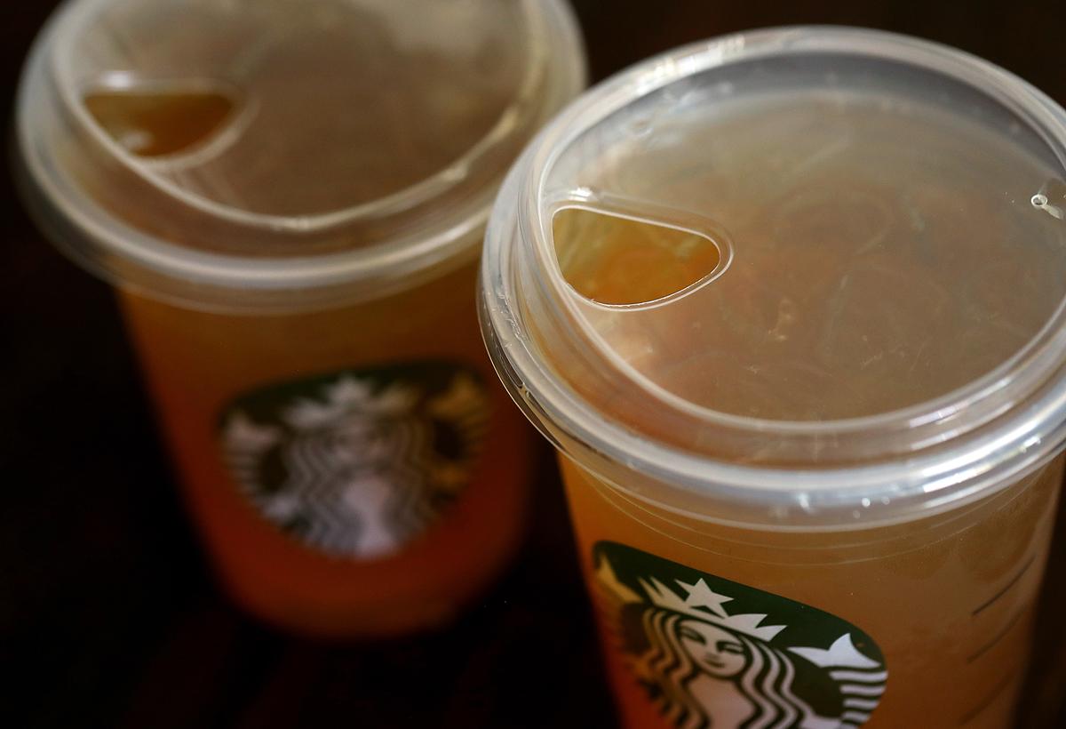 A new flat plastic lid that does not need a straw is shown on a cup of Starbucks iced tea on July 9, 2018, in Sausalito, Calif. (Justin Sullivan/Getty Images)