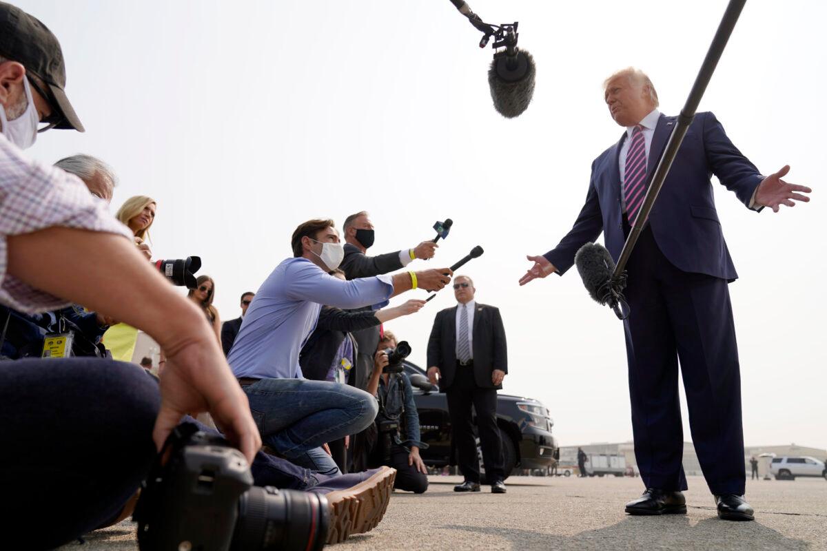 President Donald Trump speaks to reporters as he arrives at Sacramento McClellan Airport, in McClellan Park, Calif., for a briefing on wildfires, on Sept. 14, 2020, for a briefing on wildfires. (Andrew Harnik/AP Photo)