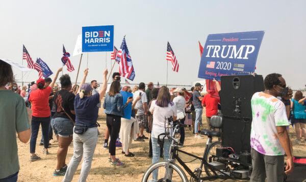 Protesters supporting Joe Biden hold signs and flags at Sacramento McClellan Airport on Sept. 14, 2020. (Nancy Han/The Epoch Times)