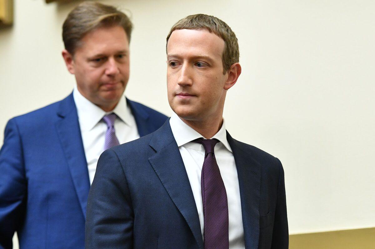 Facebook Chairman and CEO Mark Zuckerberg returns from a recess as he testifies before the House Financial Services Committee on "An Examination of Facebook and Its Impact on the Financial Services and Housing Sectors" in the Rayburn House Office Building in Washington, on Oct. 23, 2019. (Mandel Ngan/AFP via Getty Images)