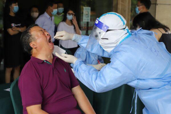 A resident is tested for COVID-19 in Ruili in southwestern China's Yunnan Province on Sept. 15, 2020. (STR/AFP via Getty Images)