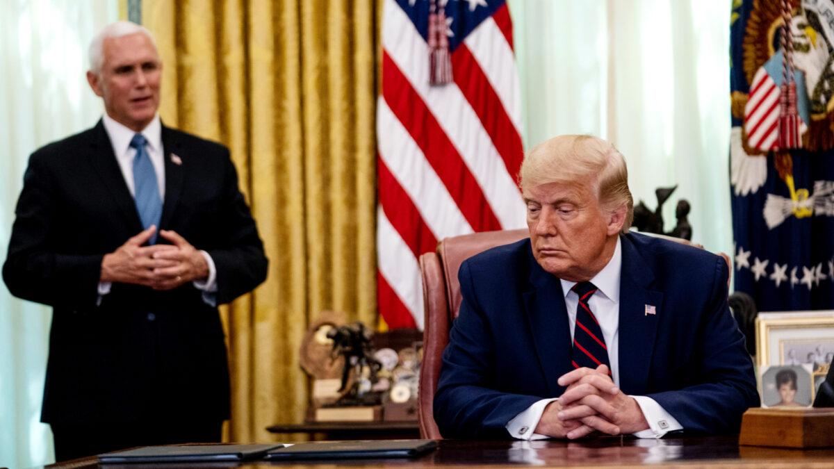  Vice President Mike Pence speaks as President Donald Trump listens, in the Oval Office of the White House on Sept. 4, 2020. (Anna Moneymaker-Pool/Getty Images)