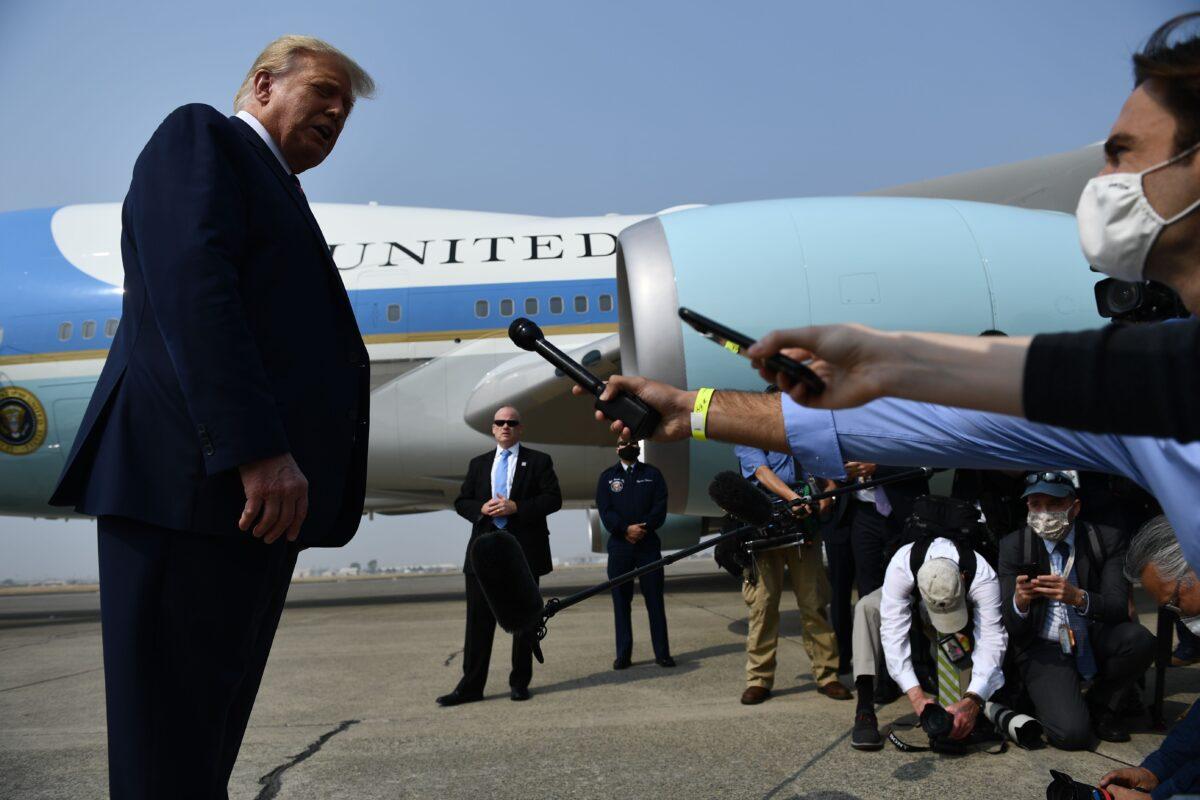 President Donald Trump speaks to the press on the tarmac as he arrives at Sacramento McClellan Airport in McClellan Park, Calif. on Sept. 14, 2020. (Brendan Smialowski/AFP via Getty Images)