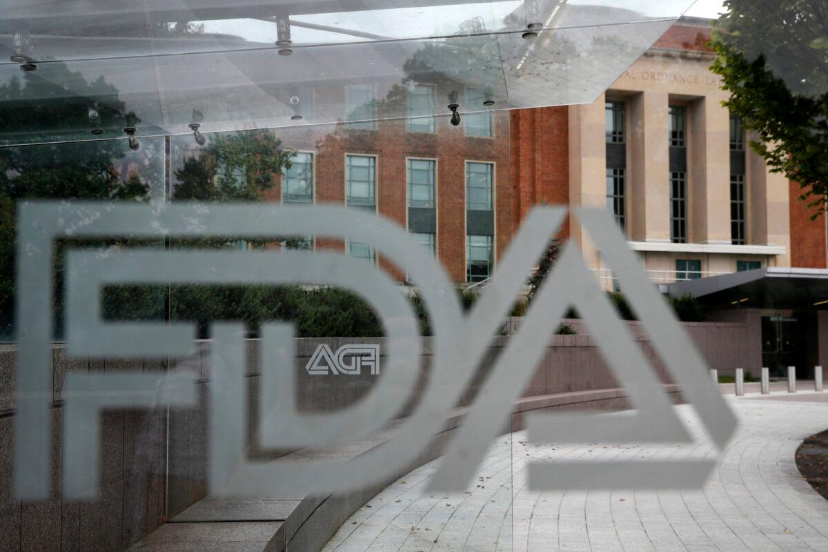 Food and Drug Administration (FDA) signage is seen through a bus stop at the U.S. Department of Health and Human Services in Silver Spring, Md., on Aug. 2, 2018. (Jacquelyn Martin/AP Photo)