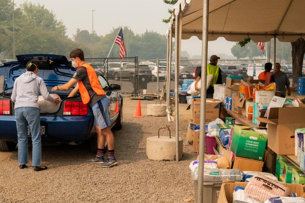 Volunteers collect donated supplies at the Jackson County Expo Center evacuation shelter in Medford, Ore., on Sept. 16, 2020. (Nathan Howard/Getty Images)