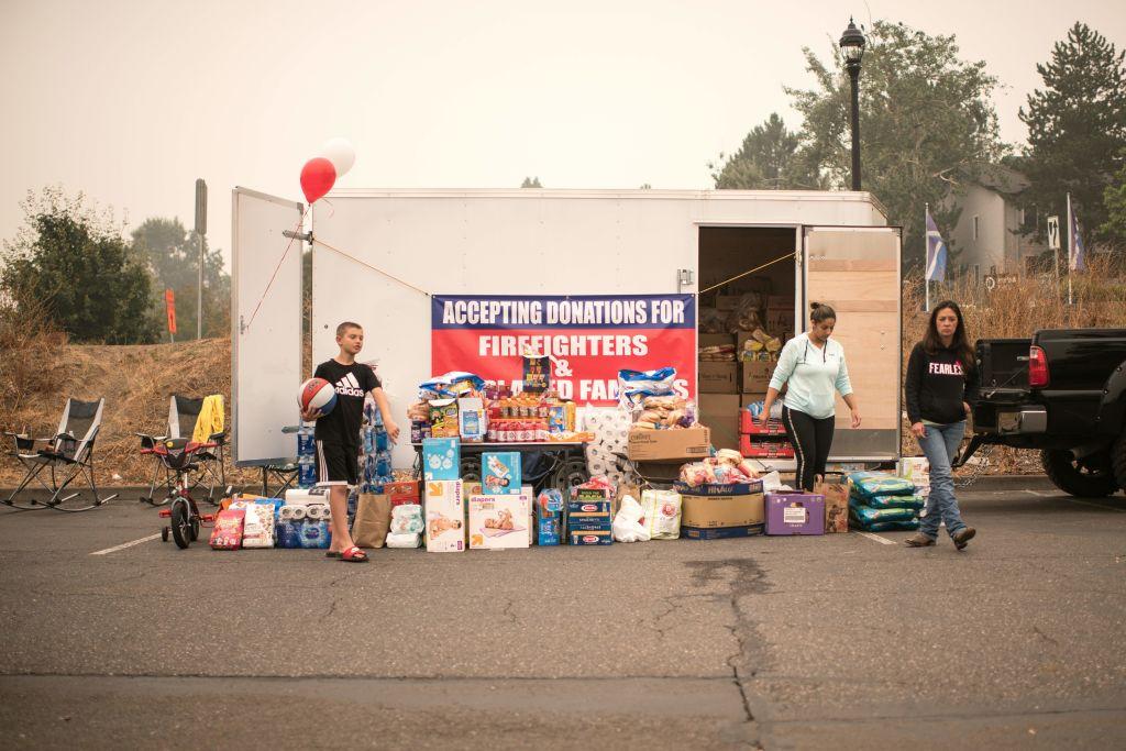 A volunteer-run donation station at an evacuation site in the parking lot of the Clackamas Town Center in Happy Valley, Ore., on Sept. 11, 2020. (MATHIEU LEWIS-ROLLAND/AFP via Getty Images)
