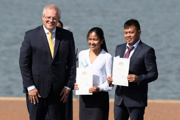 Australian Prime Minister, Scott Morrison poses for photos with new Australians during the citizenship ceremony at Lake Burley Griffin on January 26, 2020 in Canberra, Australia. (Rohan Thomson/Getty Images)