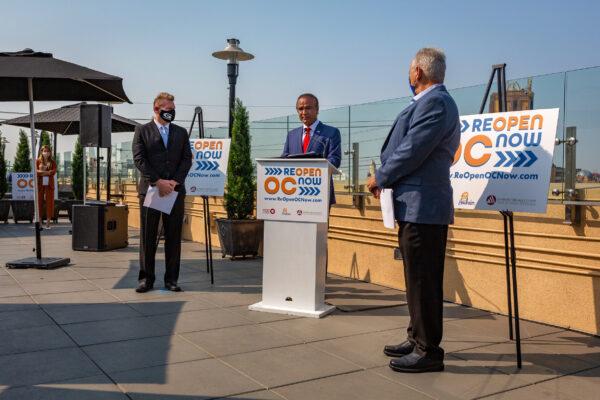Garden Grove Mayor Steve Jones, left, Anaheim Mayor Harry Sidhu, center, and Buena Park Mayor Fred Smith, right, gather at a news conference calling for Gov. Gavin Newsom to reopen Orange County theme parks in Anaheim, Calif., on Sept. 16, 2020. (John Fredricks/The Epoch Times)