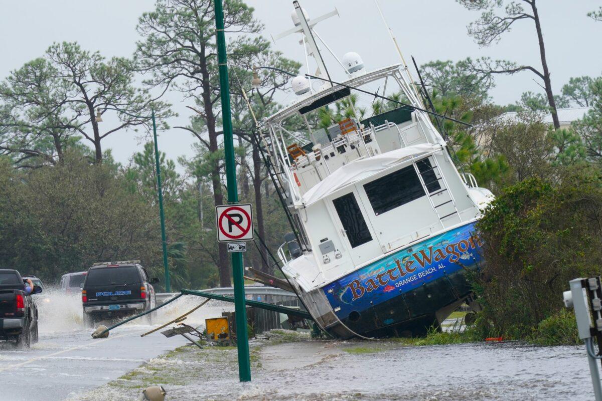  A boat is washed up near a road after Hurricane Sally moved through the area, in Orange Beach, Ala., on Sept. 16, 2020. (Gerald Herbert/AP Photo)