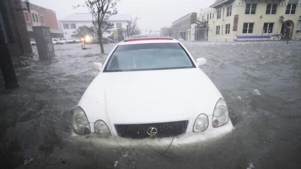 Flood waters move on the street on Sept. 16, 2020, in Pensacola, Fla. (Gerald Herbert/AP)