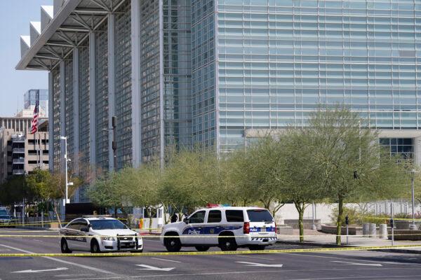 Police cars close off a street outside the Sandra Day O'Connor U.S. Courthouse in Phoenix, Arizona, on Sept. 15, 2020. (AP Photo/Ross D. Franklin)