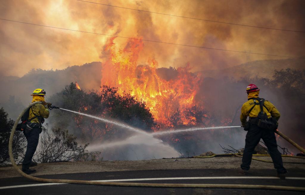 San Miguel County Firefighters battle a brush fire along Japatul Road during the Valley Fire in Jamul, California, on Sept. 6.(SANDY HUFFAKER/AFP via Getty Images)