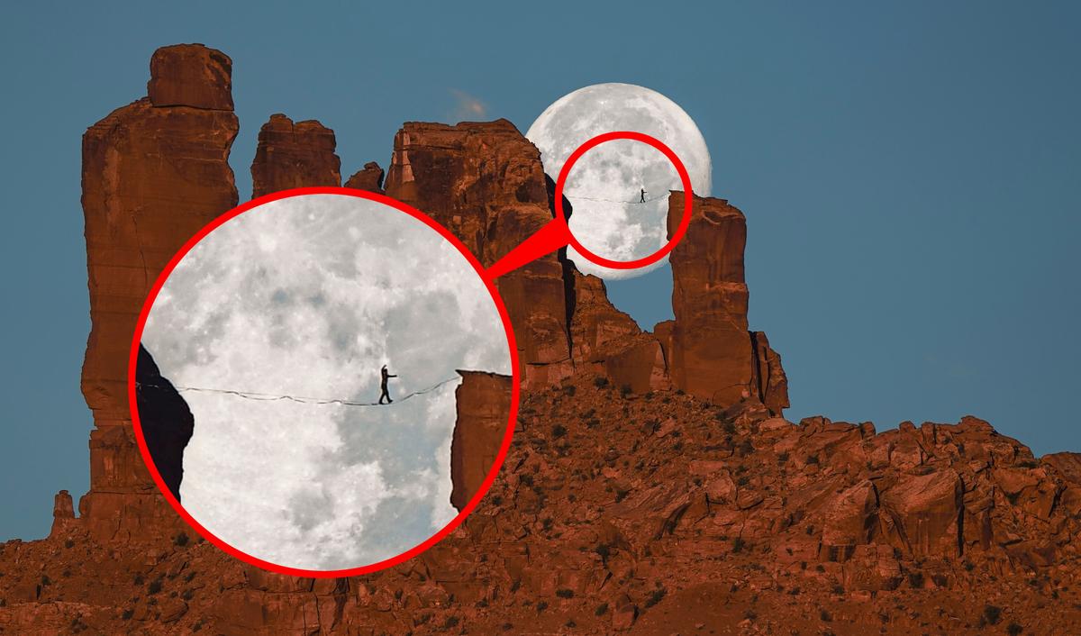 Andy Lewis walks in front of the Moon in Moab, Utah. (Caters News)