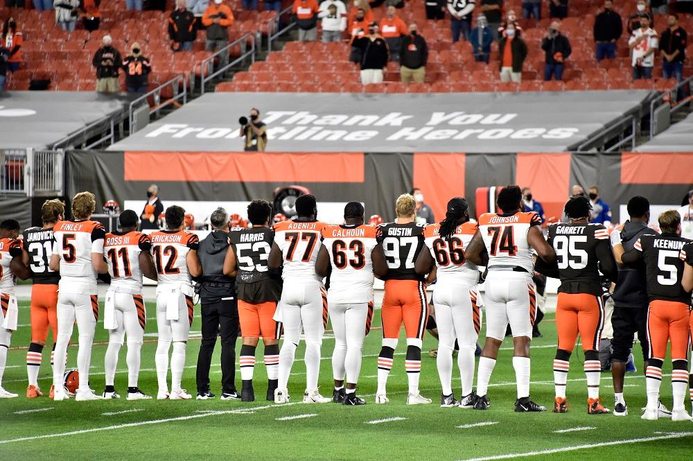 Players lock arms before the start of a game between the Cleveland Browns and the Cincinnati Bengals at FirstEnergy Stadium on Sept. 17, 2020, in Cleveland, Ohio. (Jason Miller/Getty Images)