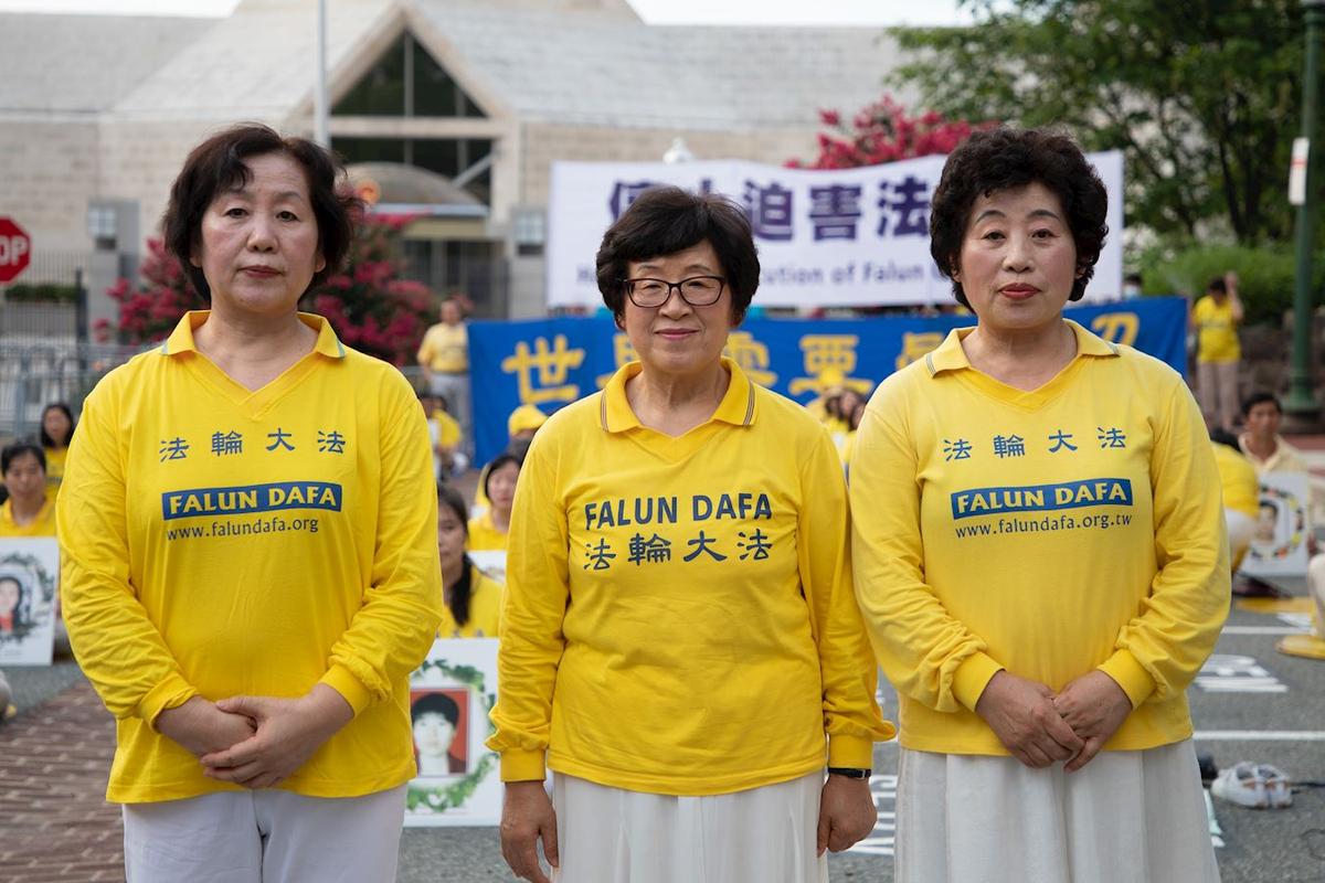 Wang Chunrong (C) with her two younger sisters, Wang Chunyan (L), and Wang Chunying (R) at a rally held in Washington in July 2020. (Lin Yueyu/The Epoch Times)