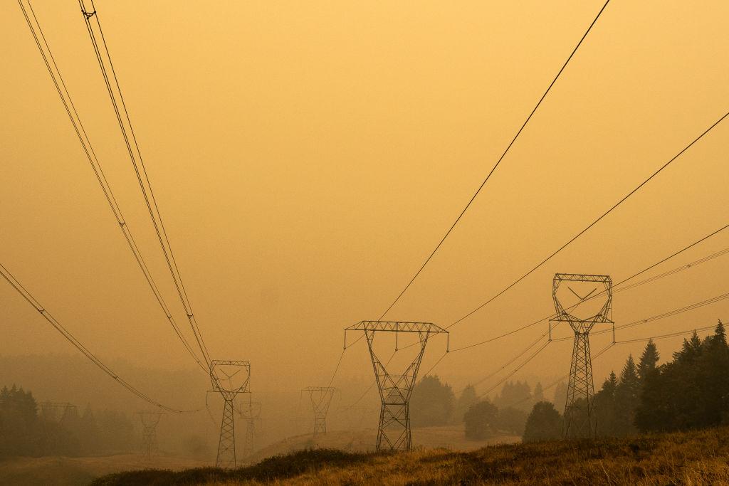 Power lines extend through heavy wildfire smoke on Sept. 10, 2020, in Estacada, Ore. (Nathan Howard/Getty Images)