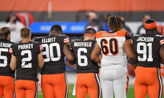 Cleveland Browns and Cincinnati Bengals Stand, Link Arms Together for National Anthem